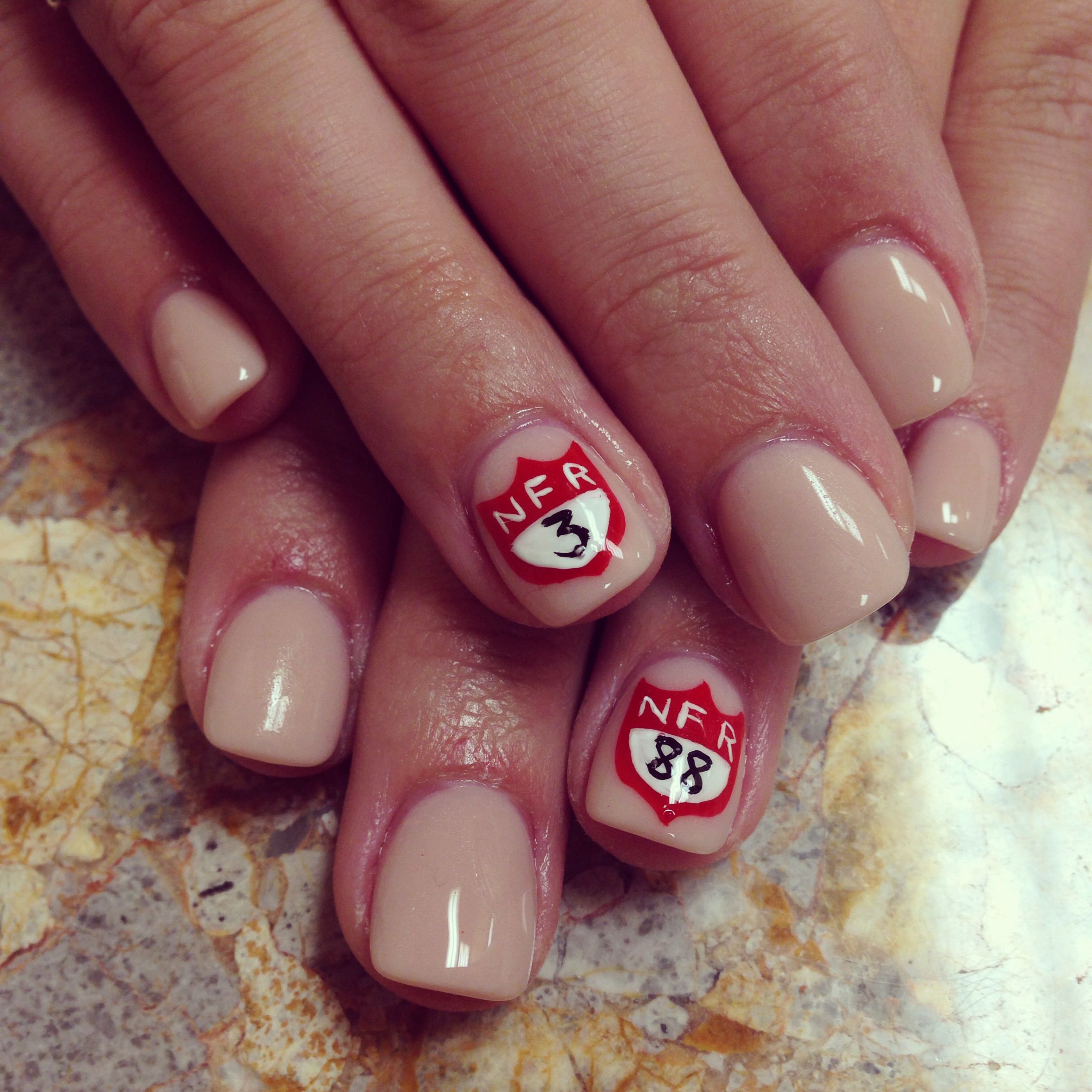 Stock contractor leading a saddle horse behind the chutes in Las Vegas