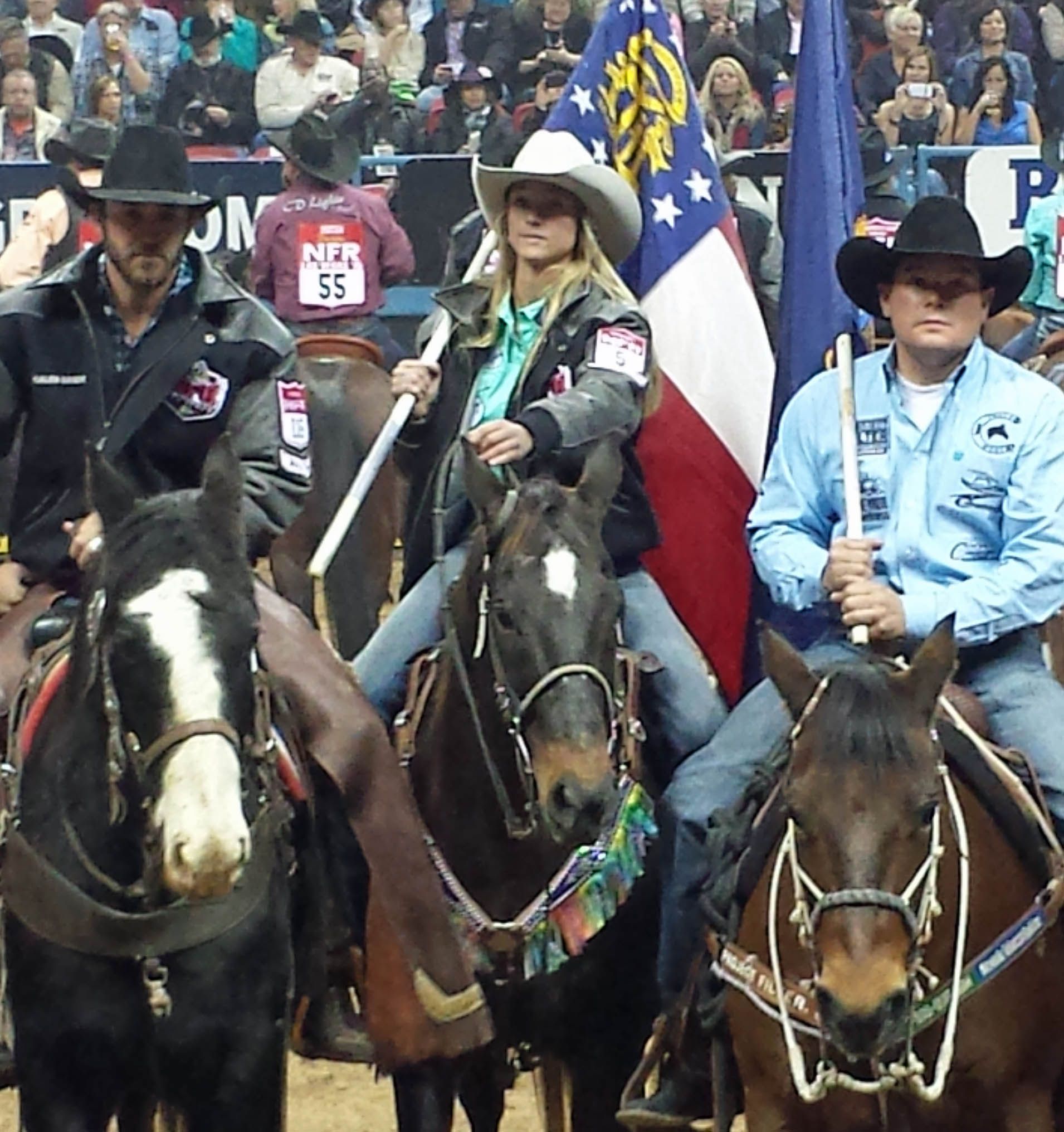 Broadcast cameras capturing a Las Vegas rodeo performance